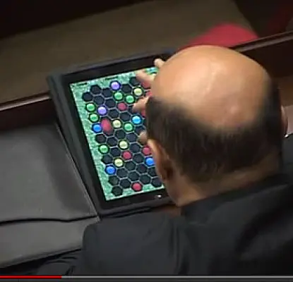 Minister Caught Playing Games on his iPad Smiles Before Evading Reporters